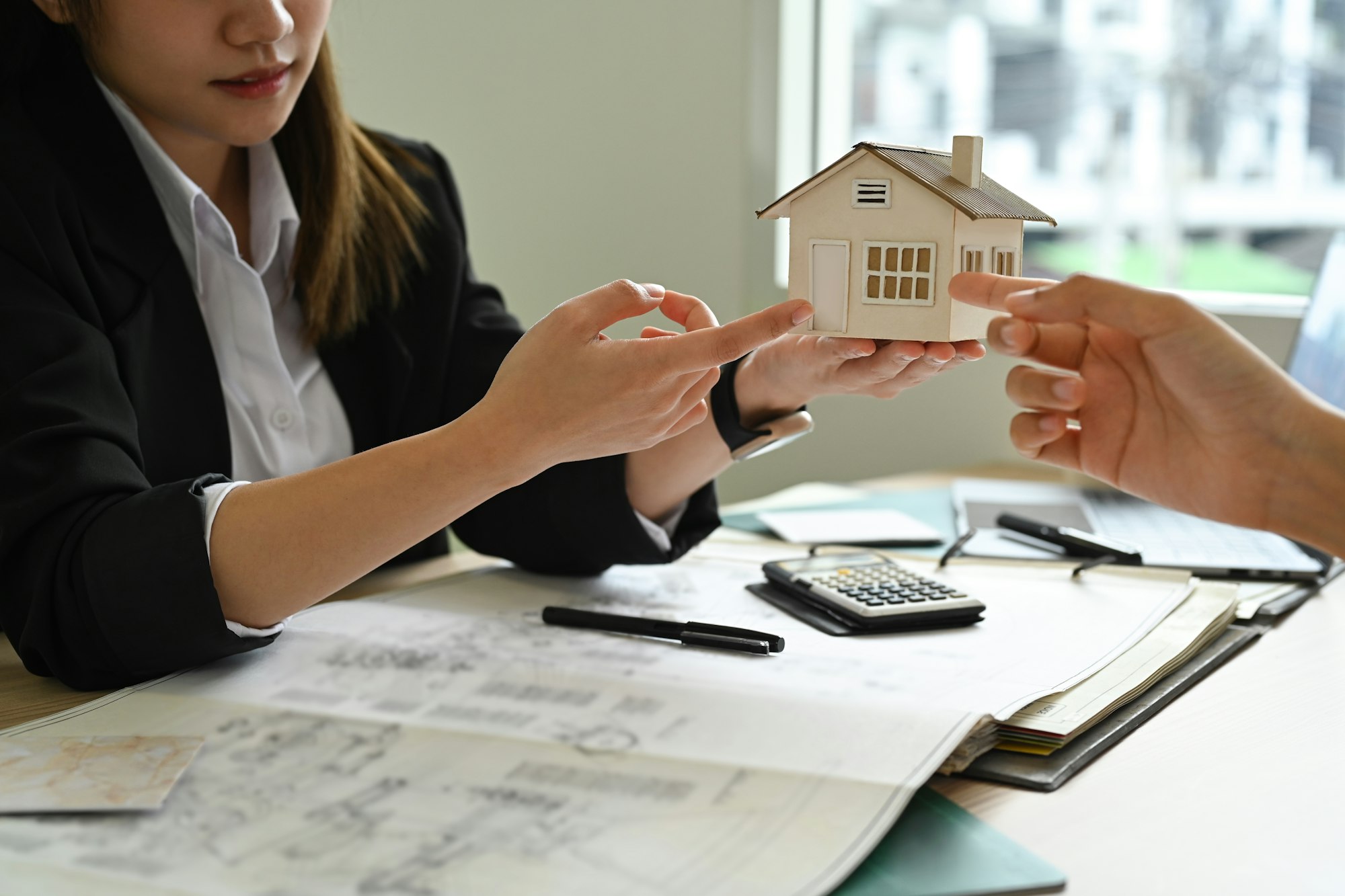 Architect team discussing, inspecting a construction project together