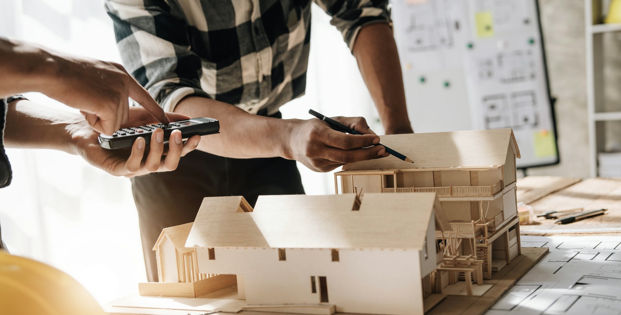 Concept architects, team engineer holding pen pointing equipment architects On the desk with a